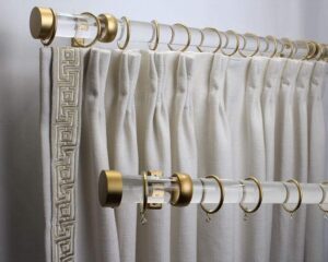 White color curtains hang on stylish Curtain rods